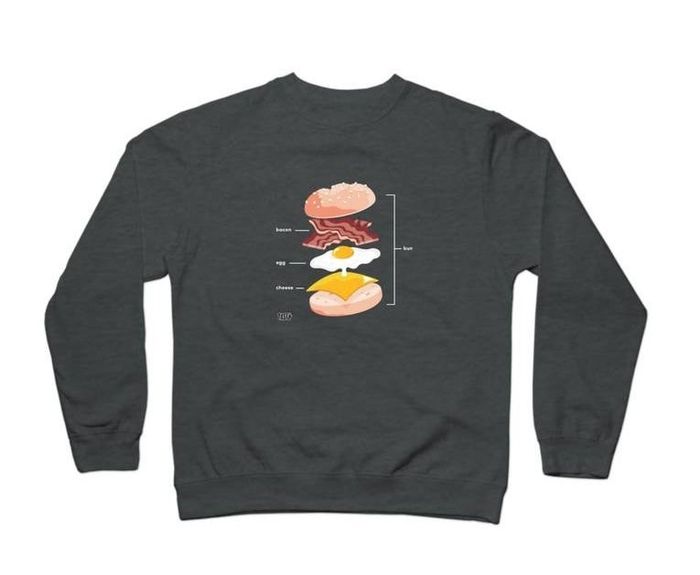 grey sweatshirt featuring all the layers of a bacon, egg, and cheese sandwich