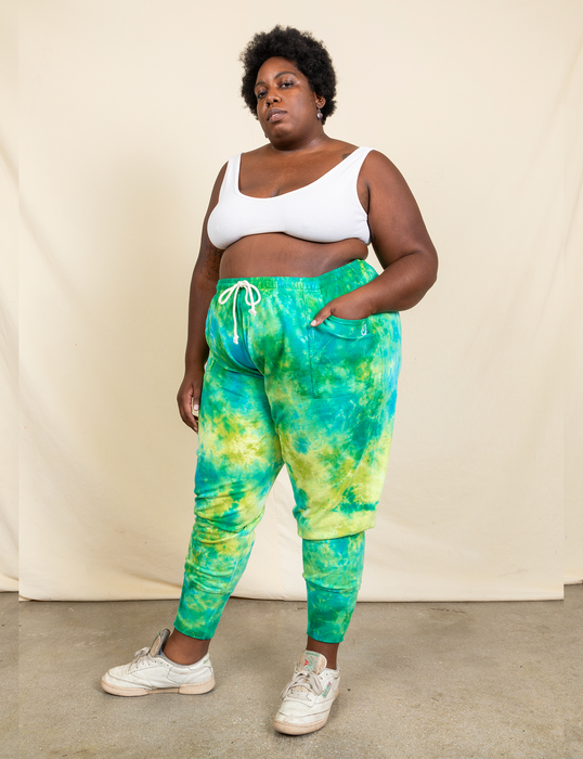 a plus-size model wearing the green lagoon sweatpants