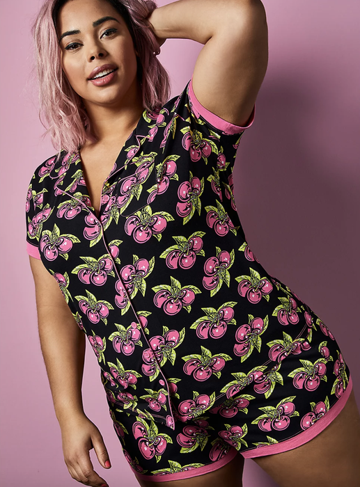 a plus-size model wearing the Betsey Johnson Black Cherry Sleep Set
