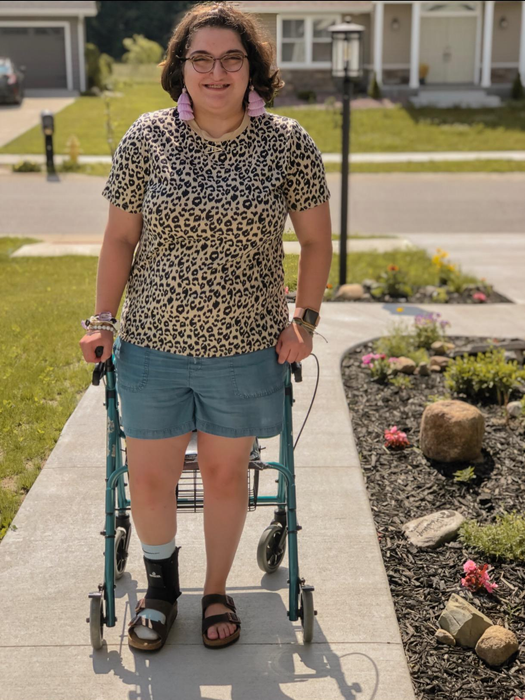 A reviewer showcasing the top paired with shorts