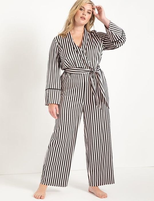 a plus-size model wearing the Boudoir Stripe Piping Trimmed Lounge Jumpsuit