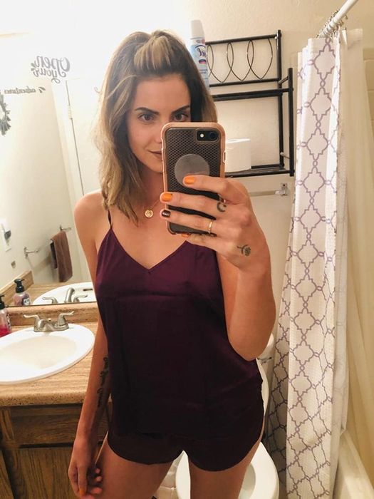 customer image of a reviewer snapping a bathroom selfie in the wineberry Ekouaer sleepwear set