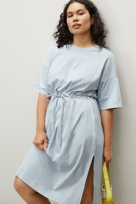a model dressed in a light blue version of the outfit