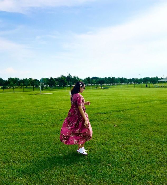 reviewer twirling in the dress