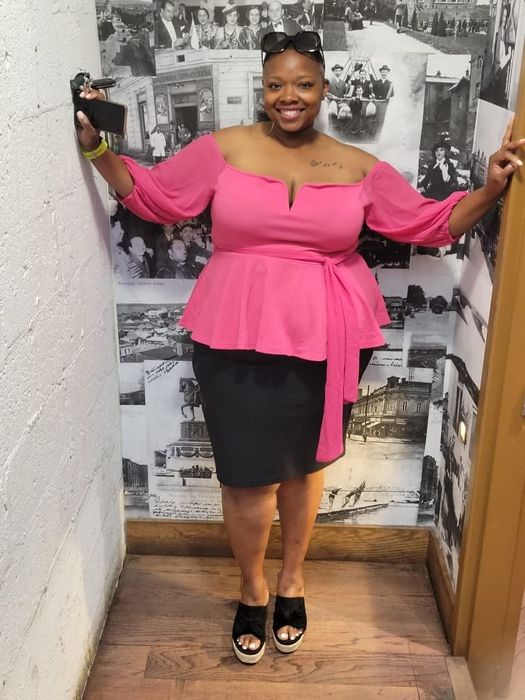 A reviewer modeling the top in pink