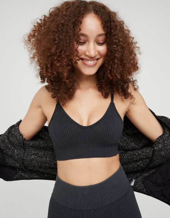 model wearing the black thin-strapped sports bra