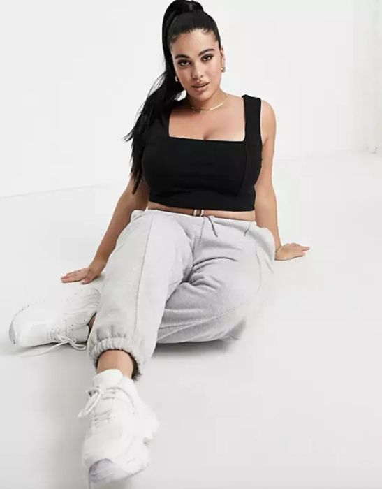 The model sits in a different pose.
