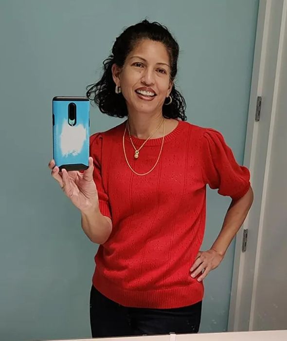 a reviewer modeling the top in a bold red color