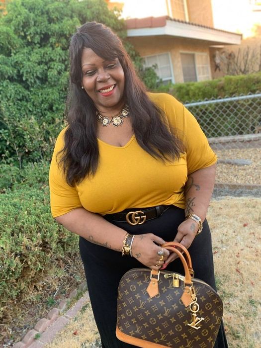 reviewer styles the tee tucked into a skirt