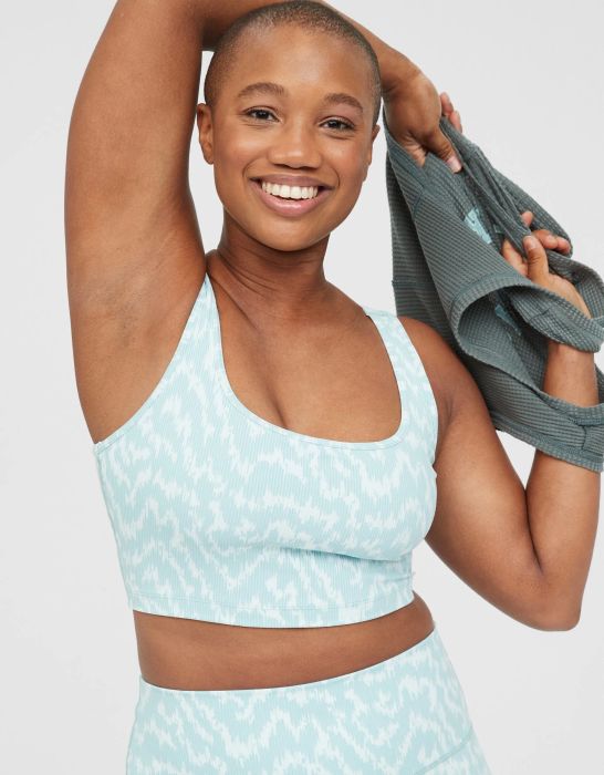 model wearing a light blue and white patterned round-neck sports bra