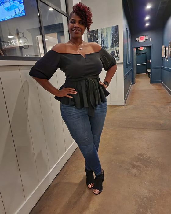 A reviewer modeling the top in black