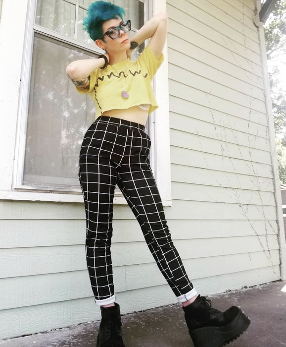 reviewer wearing the black-and-white checkered pants