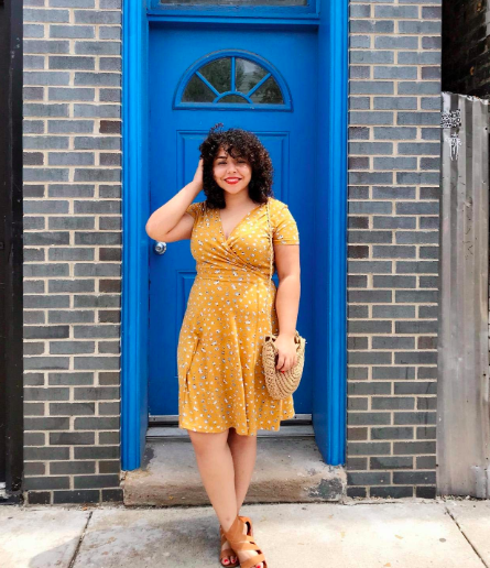 reviewer wearing the yellow dress