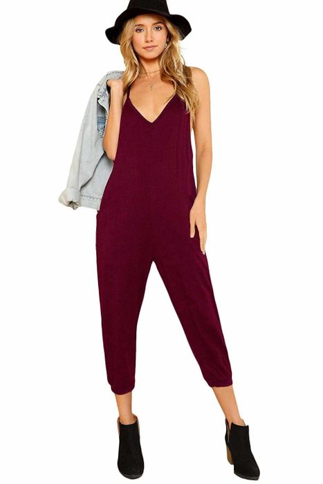A model showcasing the calf-length jumpsuit in a rich burgundy shade