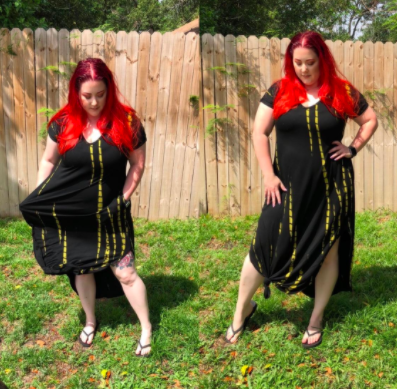 A plus-size reviewer wearing the black V-neck maxi dress with side slits and a front knot for a peek of leg