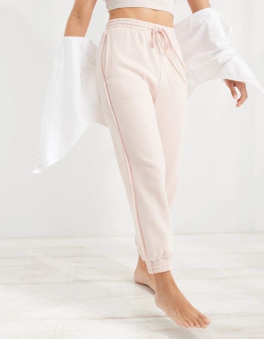 model in light pink joggers