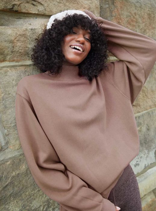 model wearing the brown sweatshirt