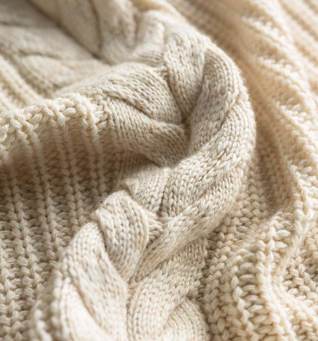 A close-up view of the cable-knit texture