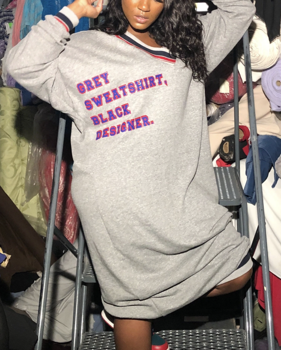 a model wearing the grey sweatshirt dress by a Black designer