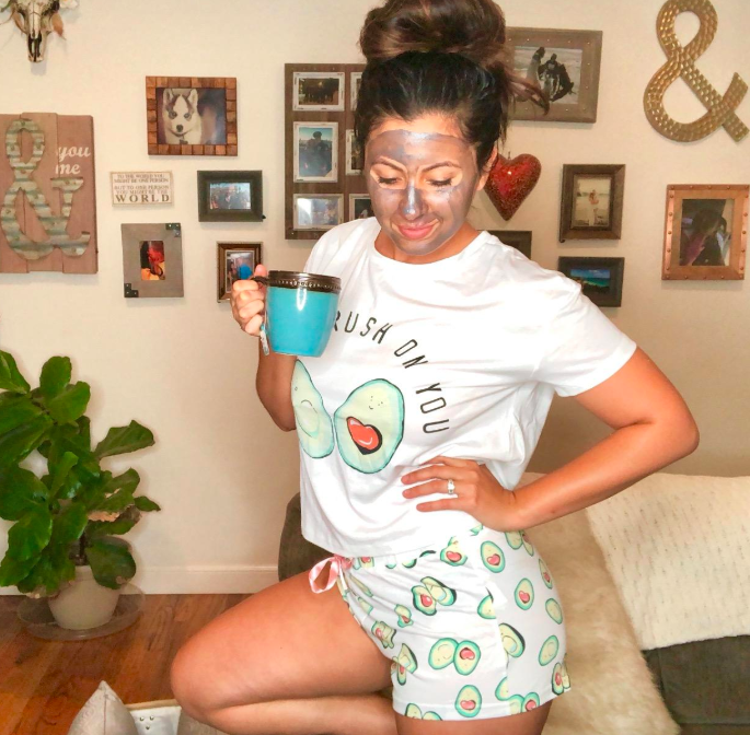 customer image of a reviewer wearing the avocado green Didk cartoon print pajama set