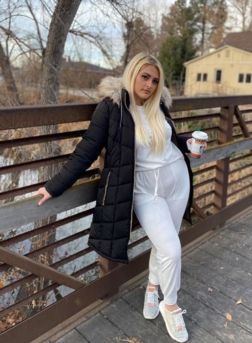 A reviewer wearing the white set
