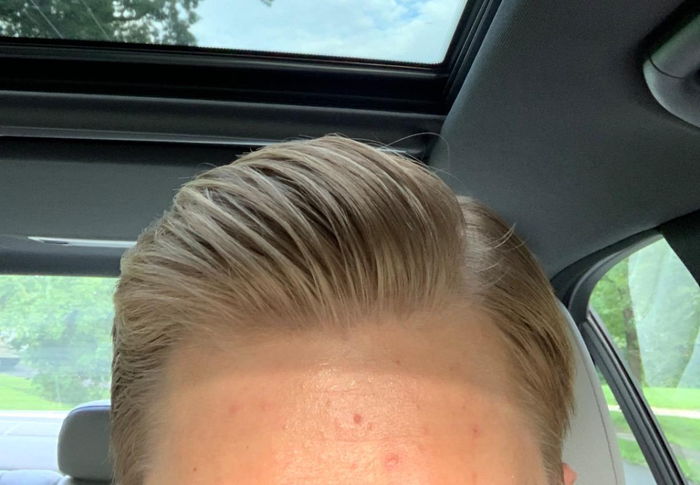 reviewer with perfectly styled hair thanks to the product