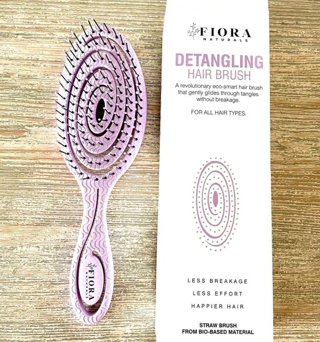The reviewer's light purple-colored brush.