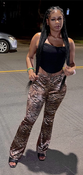 Photo of reviewer showcasing a black corset top