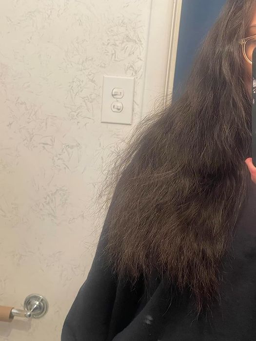 A reviewer's hair before applying the oil mask
