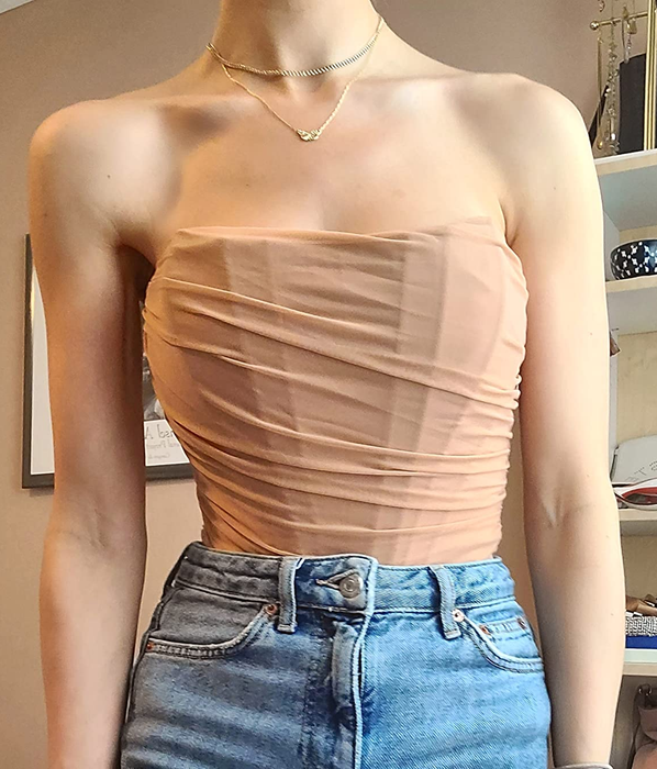 Photo of reviewer wearing a tan top