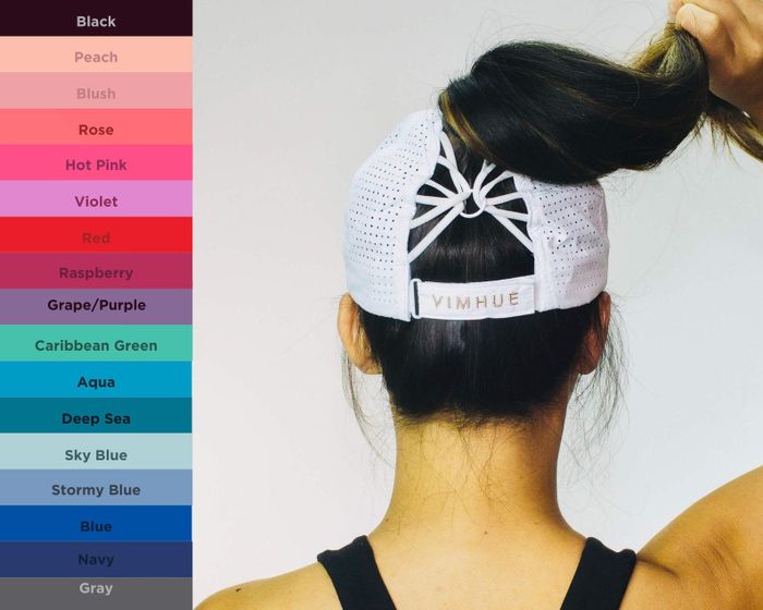 The back of the hat on a model reveals a string design where the ponytail rests.