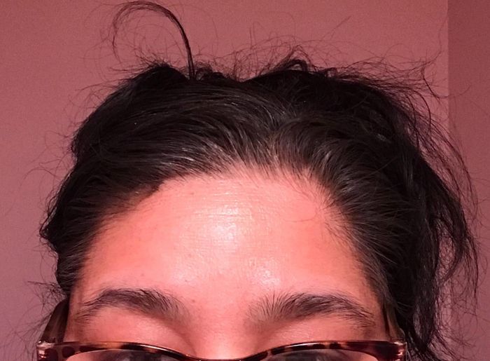 demonstrating how the spray completely covers their grays