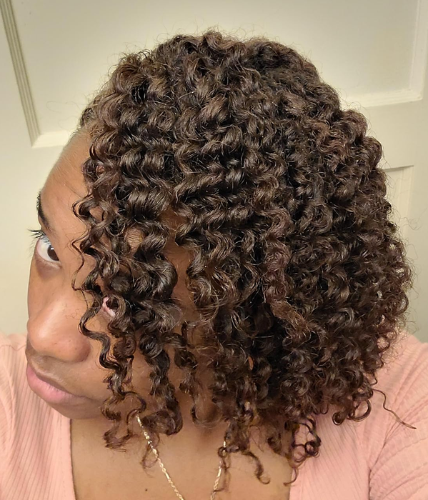 reviewer showcasing hydrated, well-defined curls in a closeup