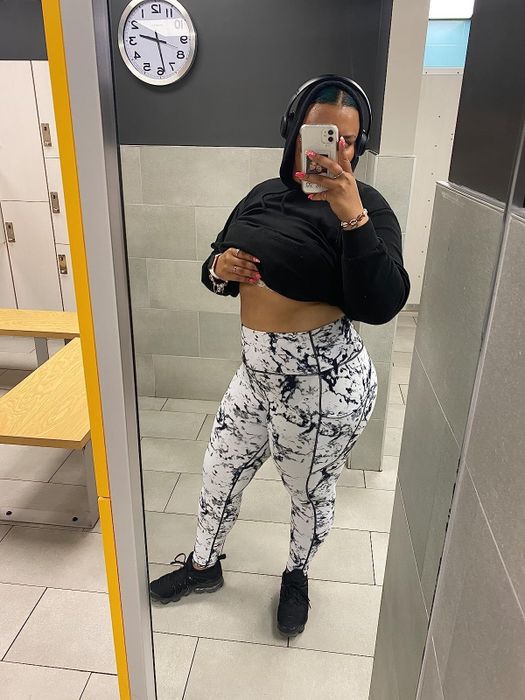 reviewer showcasing the black and white leggings
