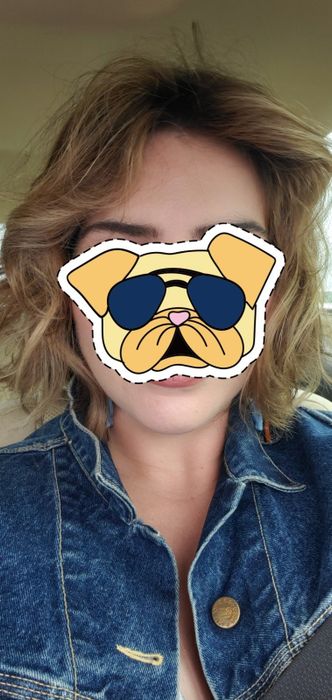 reviewer with voluminous, curled hair