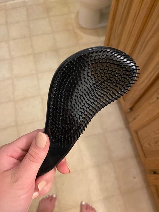 A review photo featuring the black detangling brush