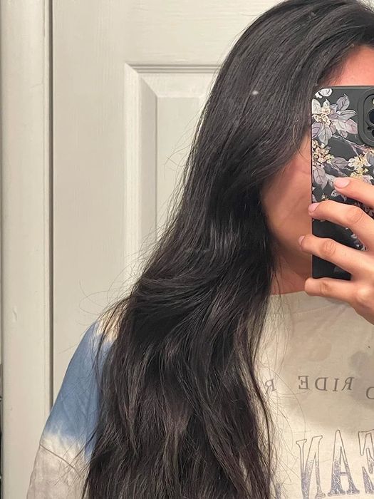 A reviewer's hair after using the oil mask