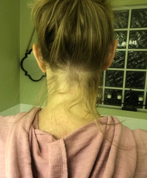 reviewer's before photo of a messy ponytail