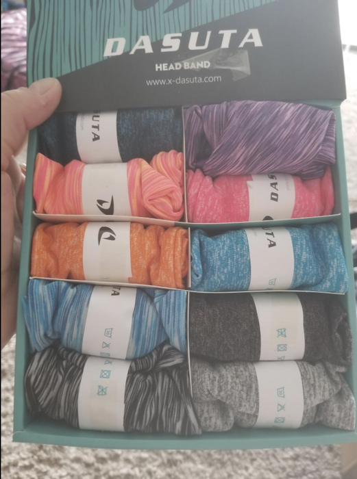 A reviewer photo displays the 10 available colors of the sweatbands.