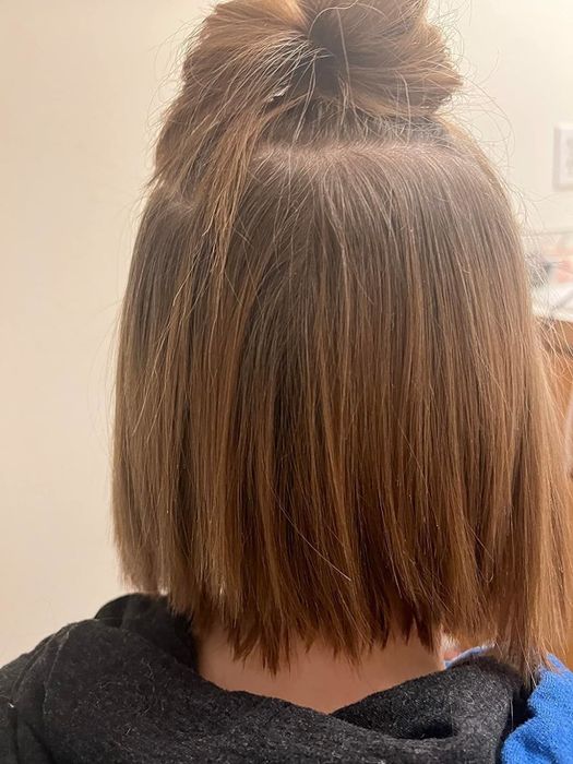 A reviewer with refreshed, clean hair after applying the dry shampoo
