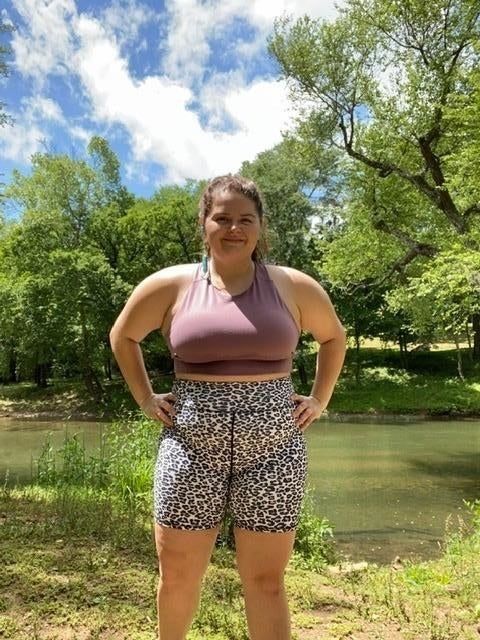 Another reviewer is seen wearing the bike shorts in a white leopard print.