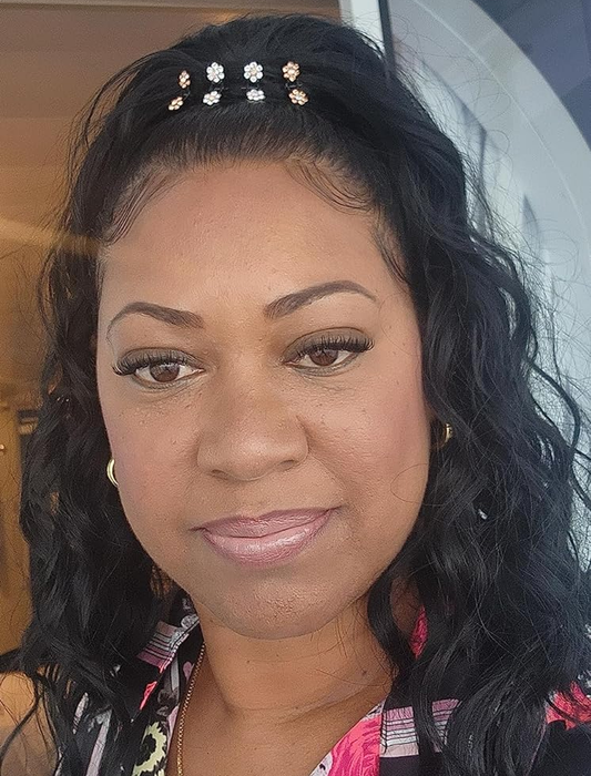 Reviewer's hair with edges neatly styled after using the edge control brush.
