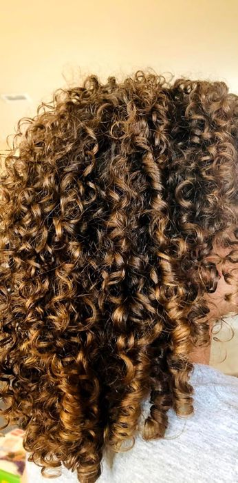 The reviewer's curls after using the brush to detangle their hair.