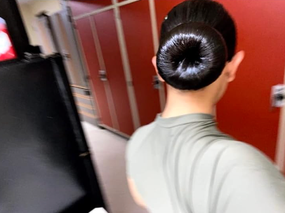 A reviewer's slicked-back hair after using the brush