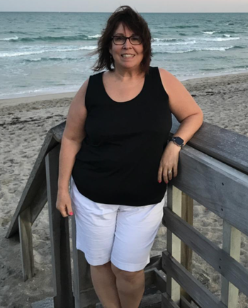 A reviewer is seen wearing the same tank top in black.