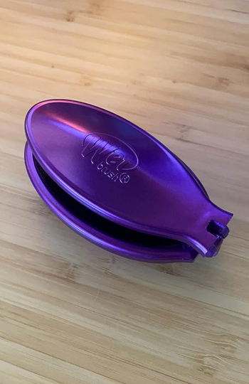 The same reviewer’s purple brush, neatly folded up for easy storage.