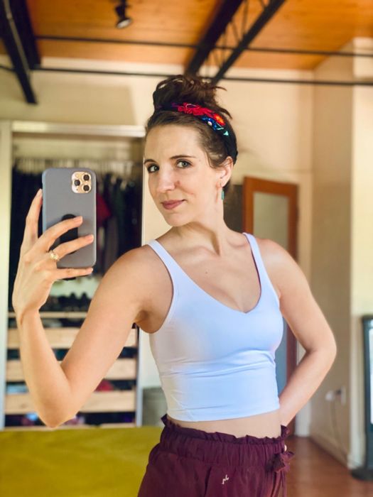 reviewer showcasing the white bra