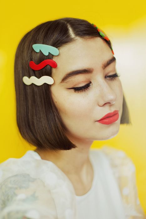 Model showcasing three wavy barrettes in their hair