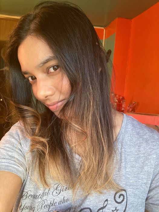 the same writer's hair now perfectly straightened