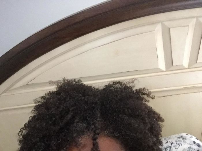 A reviewer with 4B/4C hair showcasing their beautifully defined curls